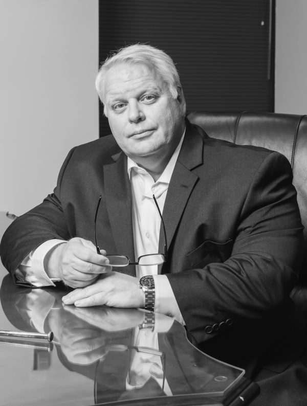 A Man Sitting On A Table