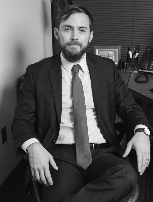 A Man Wearing A Suit And Tie